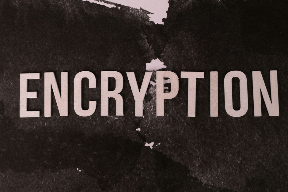 Black and white abstract image with the word 'ENCRYPTION' prominently displayed.