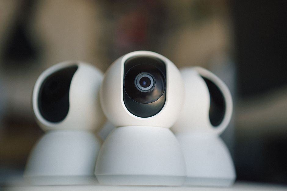 Close-up of sleek security cameras ensuring safety and privacy in indoor settings.