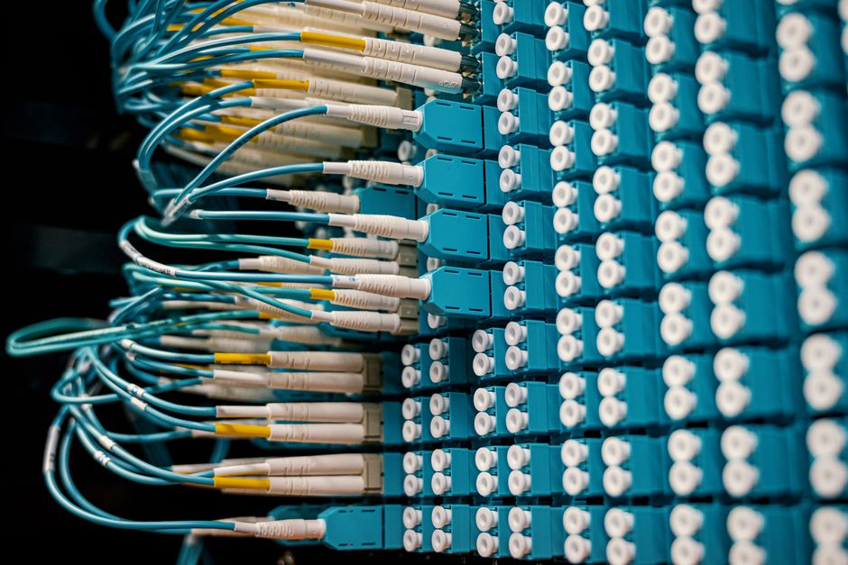 Cable organizer with set of various network wires in switch and connected with equipment
