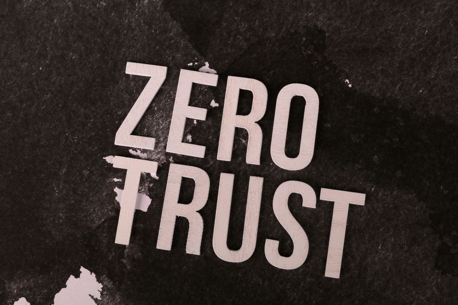 Bold 'Zero Trust' text against a textured black background, symbolizing cybersecurity.